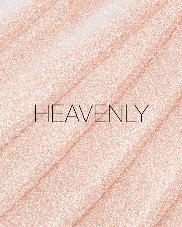מריחה של סטיק ההארה Light Reflecting Luminizing Stick של NARS בגוון Heavenly, על רקע בהיר. התמונה מדגישה את הגוון הוורוד האופלסנטי, הברק העדין והגימ